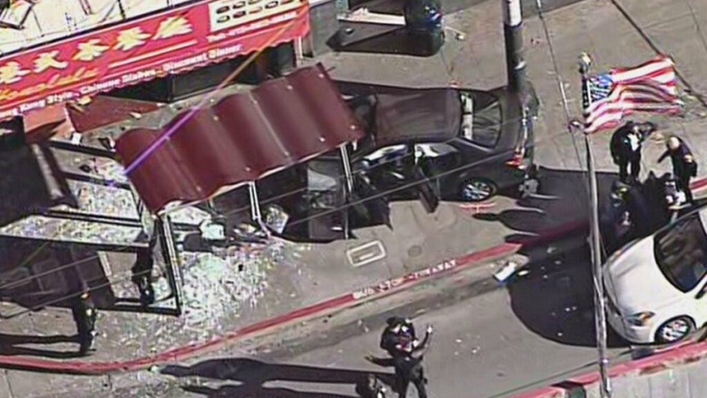 chinatown-car-crashes-into-buse-stop
